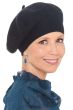 Woman in black winter wool beret hat for cancer patients