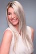 Woman in an extra long ash blonde lace front wig