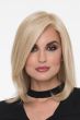 Woman in a past the shoulders straight light blonde light blonde wig with long face framing layers