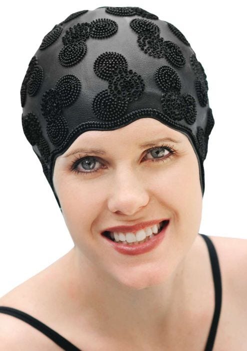 Woman in black rubber textured swimming cap for women