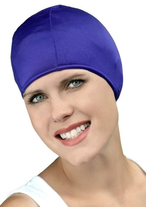 Woman in purple lycra fabric swimming cap