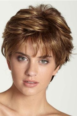 Woman in a medium brown pixie wig with longer hair on the top and sides