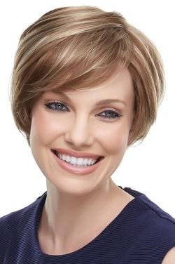 Woman in a long light brown shaggy pixie wig with side bangs