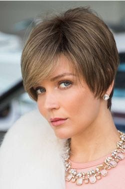 Woman in an extra long light brown pixie wig with side bangs