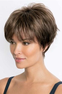 Woman in a shaggy long light brown pixie wig with fringe layers