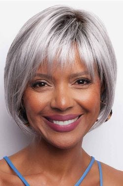 African American woman in a chin length silver bob wig with fringe bangs