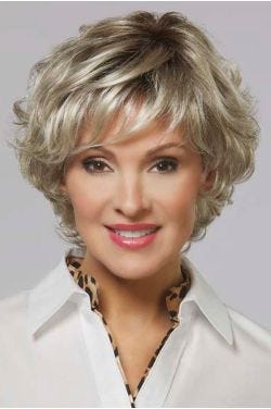 Woman in a short, curly ash blonde bob lace front wig with side bangs