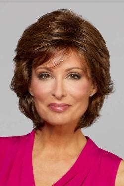 Woman in a past the chin dark auburn layered bob wig with layers throughout and wispy bangs