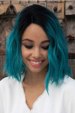 Black woman in a shoulder length teal wavy lace front wig