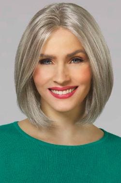 Woman in a shoulder length light grey blunt bob wig