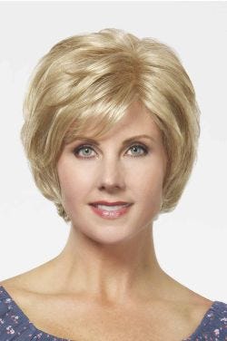 Woman in a chin length light blonde short layered lace front wig