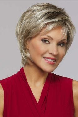 Woman in a close cropped ash blonde short lace front wig with wispy bangs