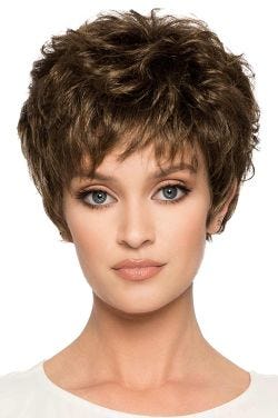 Woman in a long medium brown pixie wig with wispy bangs