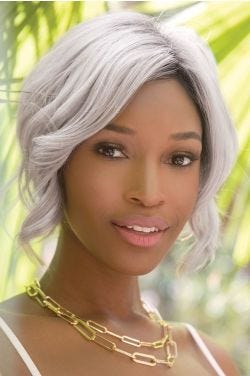 African American woman in an angled chin length curly silver lace front wig