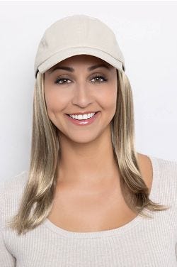 Woman in a solid beige baseball cap with extra long dark brown hair attached