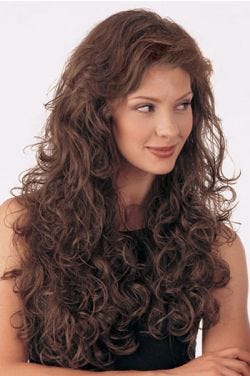 Woman in an extra long ultra curly dark brown 3/4 cap hair piece fall