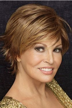 Raquel Welch in a medium auburn long pixie wig with choppy layers and side-swept bangs