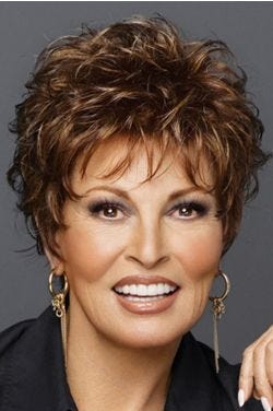 Raquel Welch in short curly wig with bangs and layers