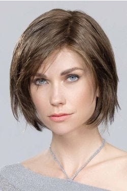 Woman in a past the chin medium auburn lace front rounded bob wig