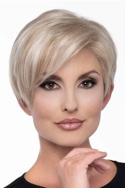 Woman in a long platinum blonde pixie wig with side bangs