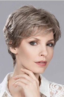 Woman in a long grey and brown lace front pixie wig