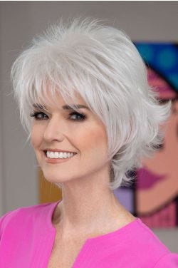 Woman in a short textured light brown wig