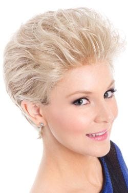 Woman in a brushed back platinum long pixie wig