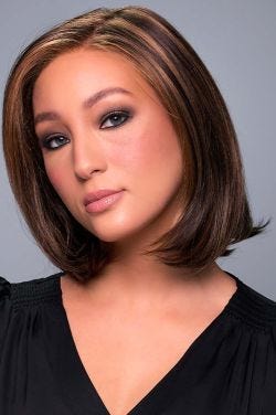 Woman in a shoulder length straight dark auburn lace front wig