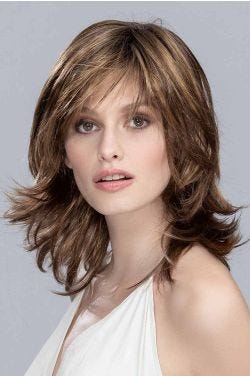 Woman in a shoulder length deep red layered bob wig with side bangs