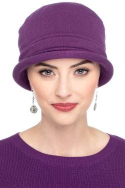 Woman in purple cotton knitted hat for cancer patients
