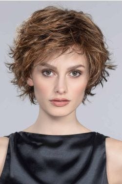 Short textured shag wig with wispy bangs and layered volume