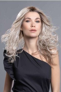 Woman in an extra long straight red to light blonde lace front wig