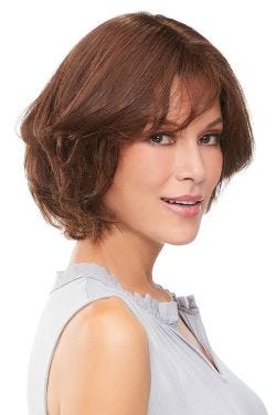 Woman in an 8" medium auburn human hair topper for thinning hair