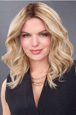 Woman in a 12" curly light blonde human hair topper for thinning hair