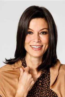 Woman in a 12" straight dark brown heat resistant hair topper for thinning hair