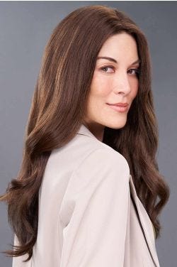 Woman in an 18" wavy brown human hair topper for thinning hair