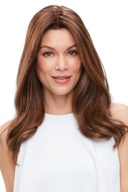 Woman in a semi-wavy 18" medium auburn human hair topper with an extra large base
