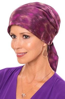 Woman in pink pre tied scarf for cancer patients