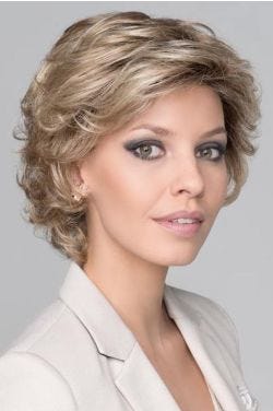 Woman in a large layered light blonde lace front wig