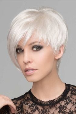 Woman in an asymmetric white wig with choppy layers