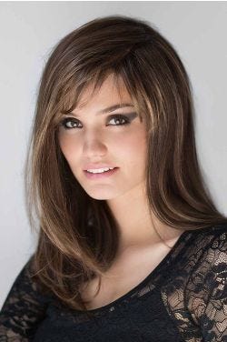 Woman in a past the shoulders medium auburn blunt cut wig with side bangs