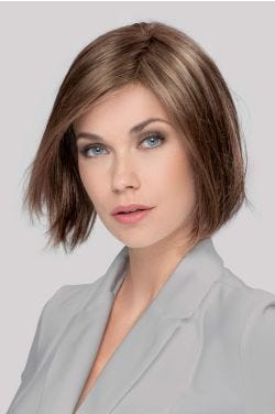 Woman in a chin length medium brown bob wig
