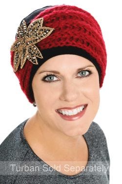 Woman in black chemo turban with red knitted headband over the top