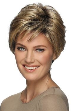 Woman in a short light brown layered wig