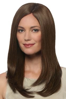 Woman in an extra long straight medium brown human hair wig with long layers
