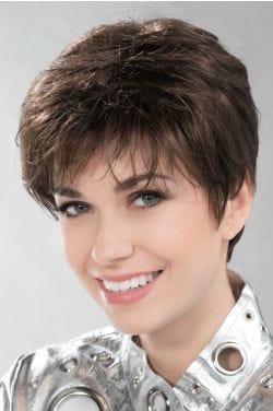 Woman in a long dark brown pixie wig with wispy bangs