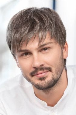 Man in a short brushed forward brown and grey lace front wig