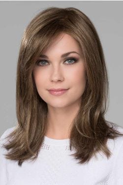 Woman in a past the shoulders straight medium brown lace front wig