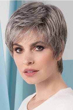 Woman in a cropped medium grey lace front pixie wig