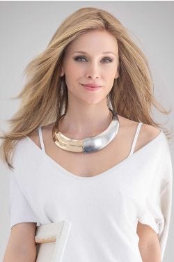 Woman in an extra long medium blonde layered lace front wig